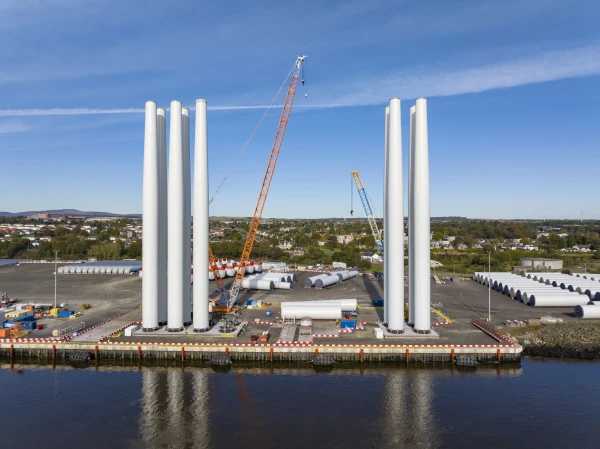 Global Wind Projects’ first offshore wind project for Siemens Gamesa at NnG wind farm. Includes details of crane and transport provision, 54 towers pre-assembled at Port of Dundee, 180,707 hours worked by 90 personnel, and use of LG1750, LR1300, and LTR220 cranes for 140.4t turbine components